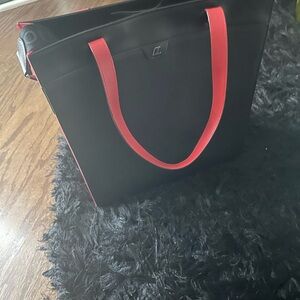 Christian Louboutin Black Tote with Red Accents on side and bottom of bag